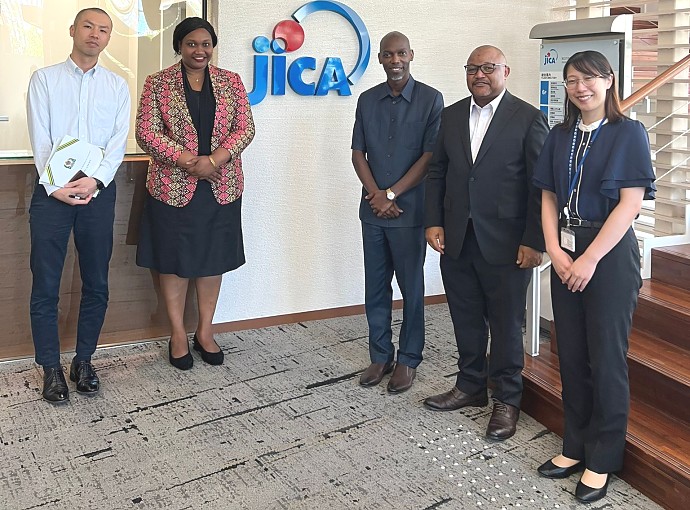 The Embassy's officials, Mr. Greyson Ishengoma, Counselor; Ms. Edna Dioniz Chuku, First Secretary - Economic Affairs and Mr. Hosea Chikolongo, Political and Cultural Attaché in a group photo with JICA staff in charge of Tanzania, at JICA HQ in Tokyo