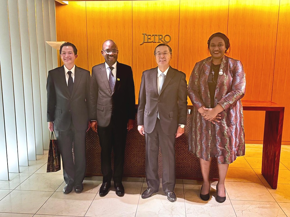 H.E. Anderson Mutatembwa in a photo with the Chairman and CEO of JETRO, Mr. Norihiko Ishiguro; accampaned by Mr. Takafumi Suzuki, Executive Vice President of JETRO and Ms. Edna Dioniz Chuku, Counsellor Economic Affairs, Embassy of Tanzania, at JETRO HQ.