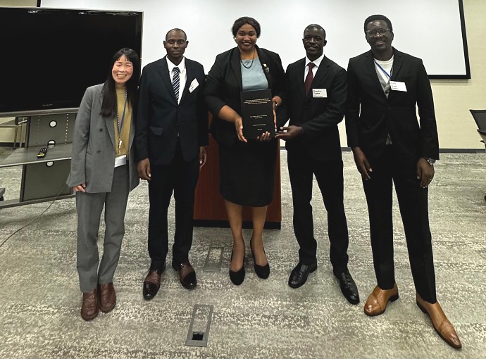 Ms. Edna Dioniz Chuku, Counselor for Economic Affairs, in a photo with Tanzania participants during the final presentation of the KIZUNA Program, including two PhD candidates and one master's degree graduate, accompanied by JICA representative, at JICA HQ